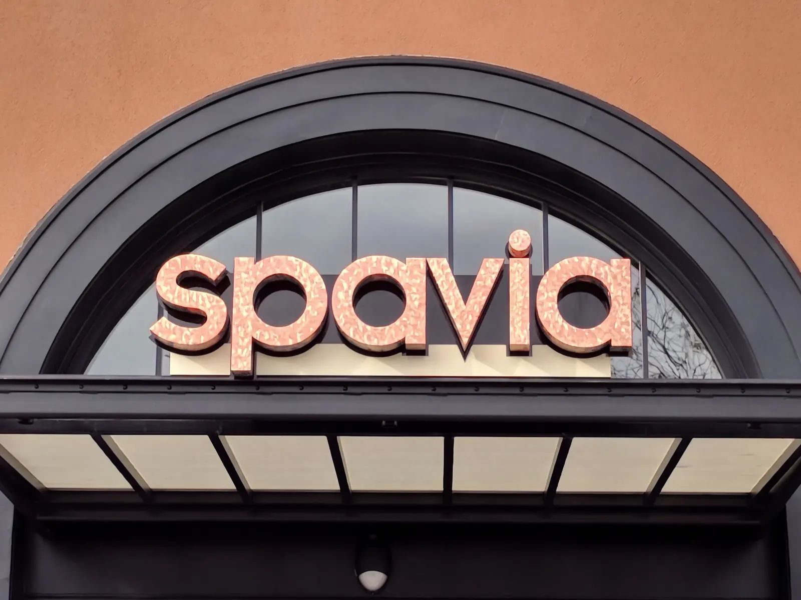 The Spavia sign over the arched entrance of Spavia Pleasant Hill on Crescent Drive