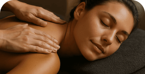 Person laying on a table receiving a back massage